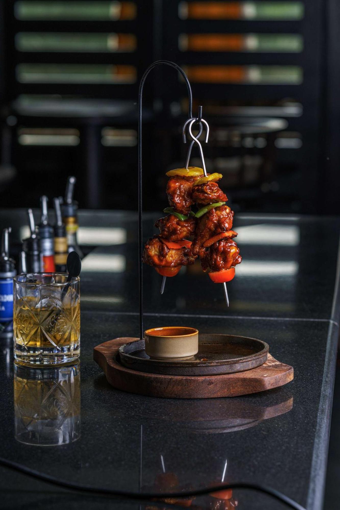 Radisson Blu Hotel & Resort, Сухар Екстер'єр фото A chicken tikka served on a skewer